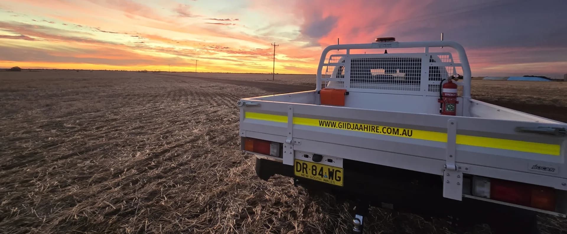 Giidjaa Hire mine spec single cab flat tray ute at sunset