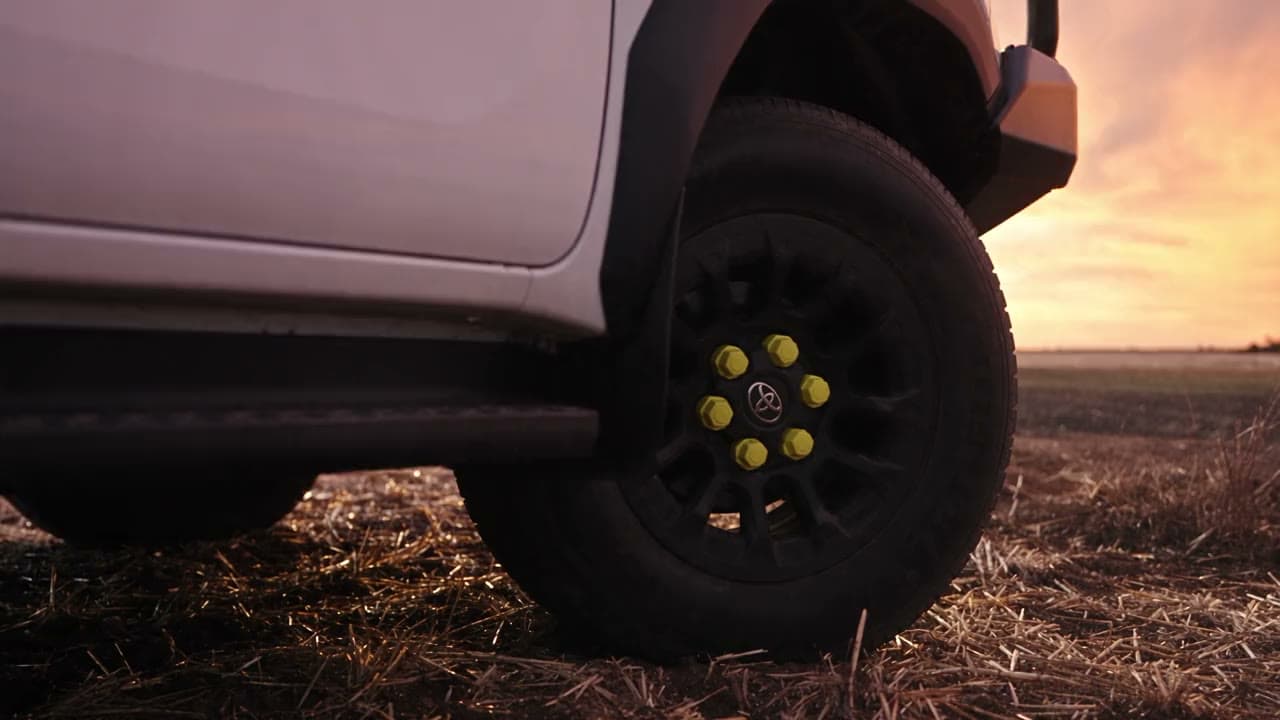 Giidjaa Hire mine spec Hilux ute on a farm road at sunset