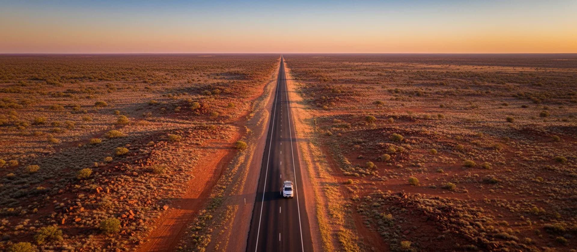 Outback highway stretching to the horizon across Australia